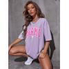 imageVerdusa Womens Summer Oversized Cute Shirt Graphic Print Short Sleeve Tunic Tops Casual Loose Drop Shoulder Crew Neck TeeLilac Purple