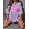 imageVerdusa Womens Summer Oversized Cute Shirt Graphic Print Short Sleeve Tunic Tops Casual Loose Drop Shoulder Crew Neck TeeLilac Purple